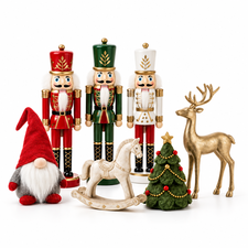 Christmas nutcrackers, a red-hatted gonk, gold deer and rocking horse on a white background
