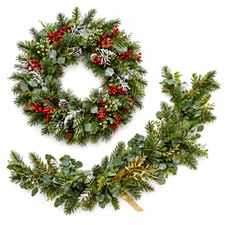Christmas wreath and garland with festive foliage and berries on a white background